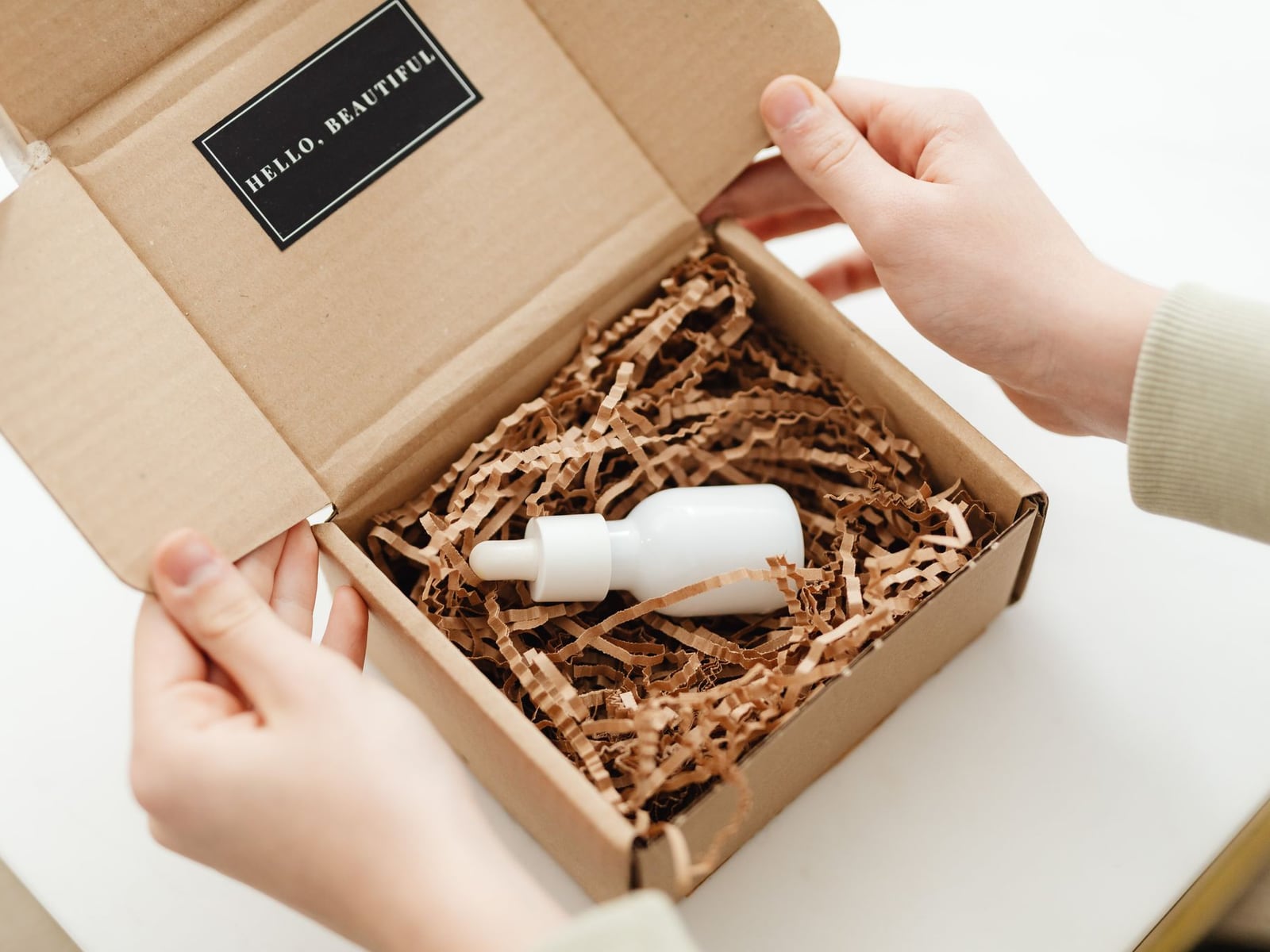Fragile products being carefully packed for shipping to a photo studio