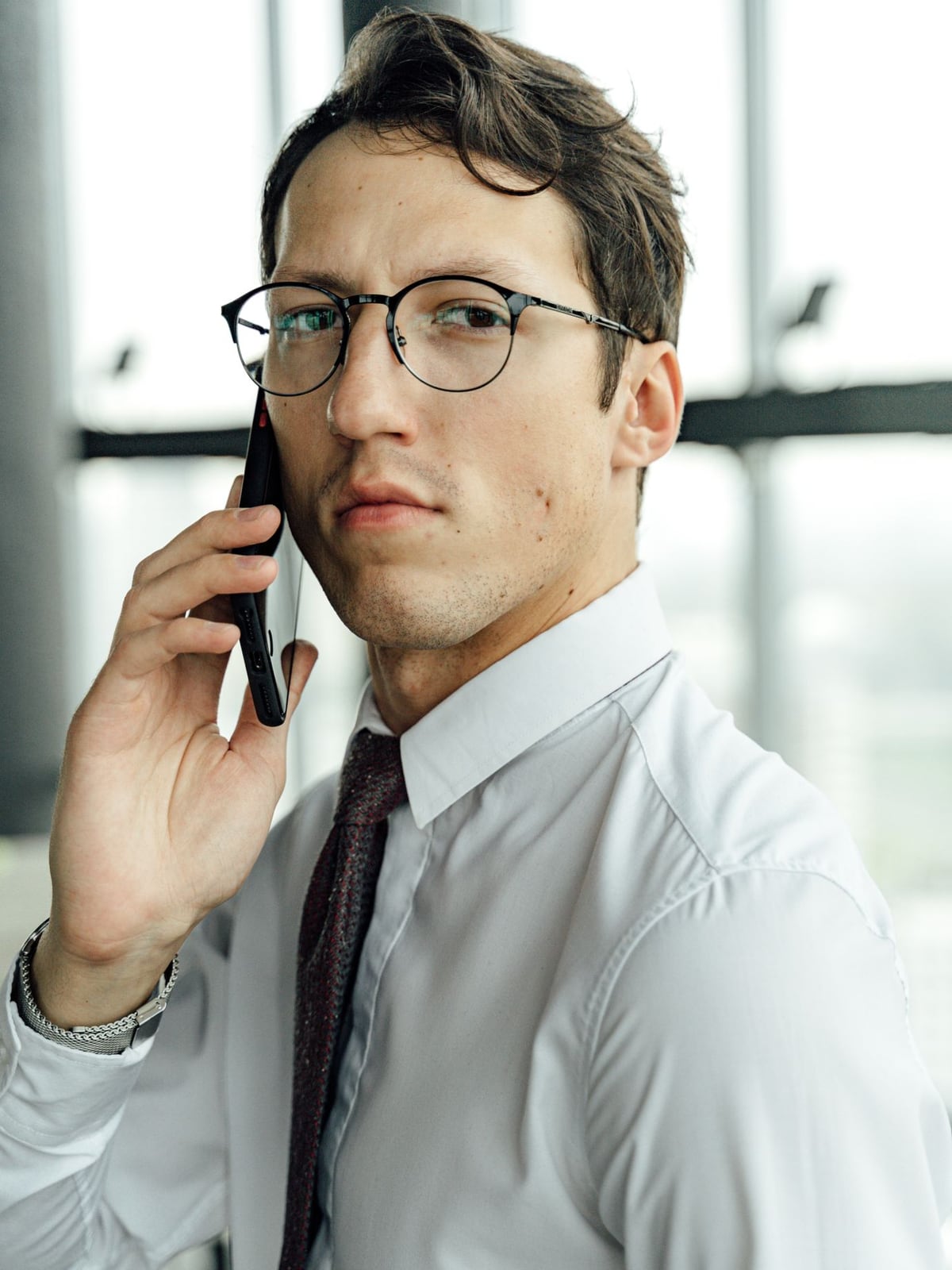 Professional corporate headshot of a businessman in a modern studio