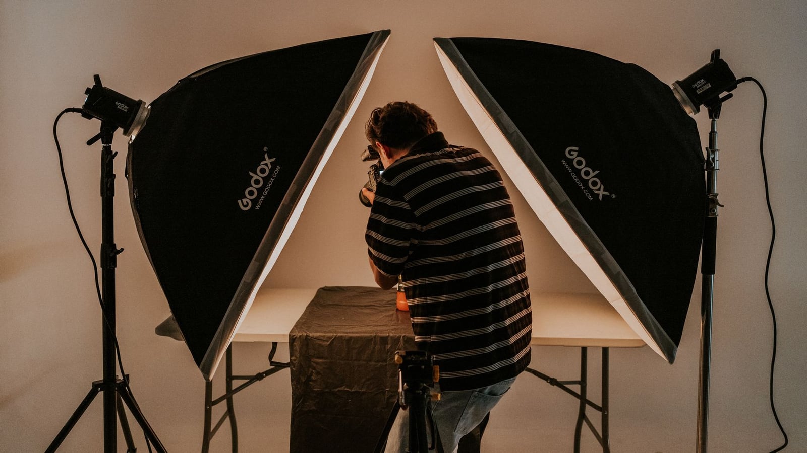 Professional studio lighting equipment ready for rental in a large room